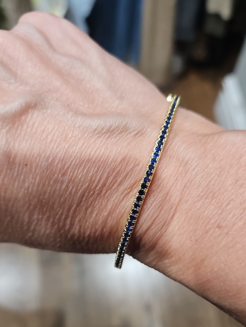 Gold Tennis Bangle Bracelet with Blue Stones - Women's Jewelry